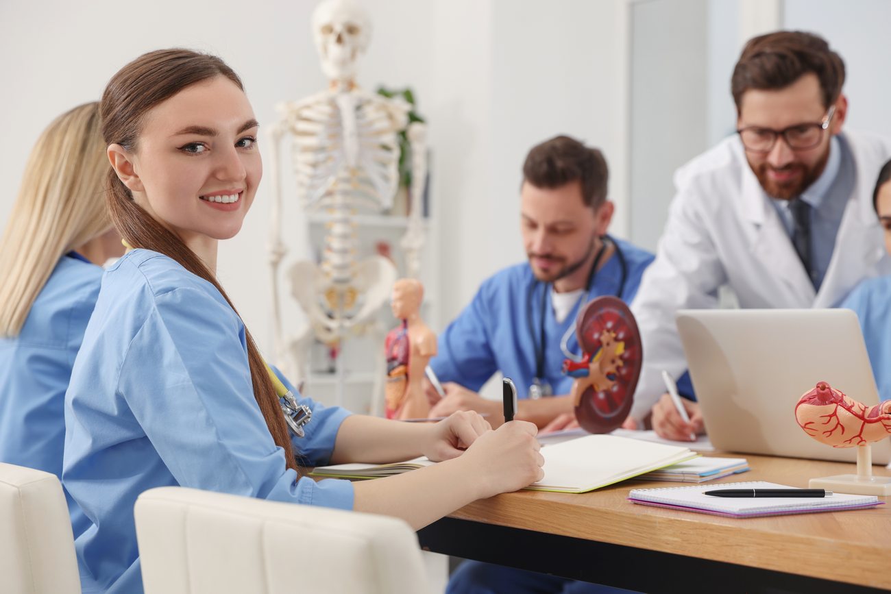 Portrait Of Young Intern Wearing Uniform On Lecture In Medical University